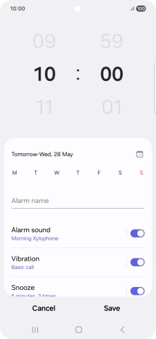 Slide your finger up or down on the hour and minute numbers to set the required alarm time.