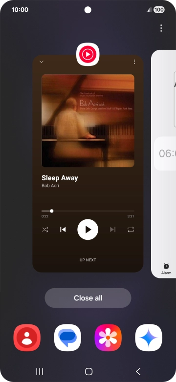 Press the first application and drag it to the top or bottom of the screen.
