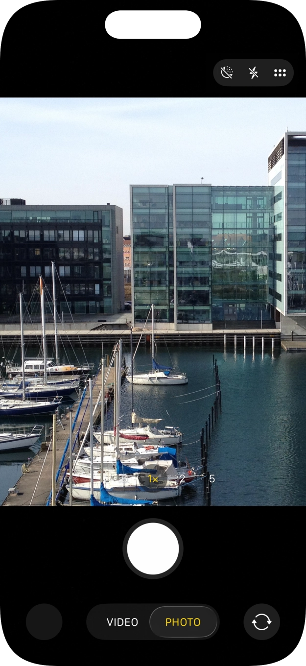 Slide your finger right or left on the screen to select the required camera mode.