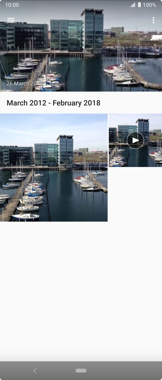 Slide your finger right starting from the left side of the screen.