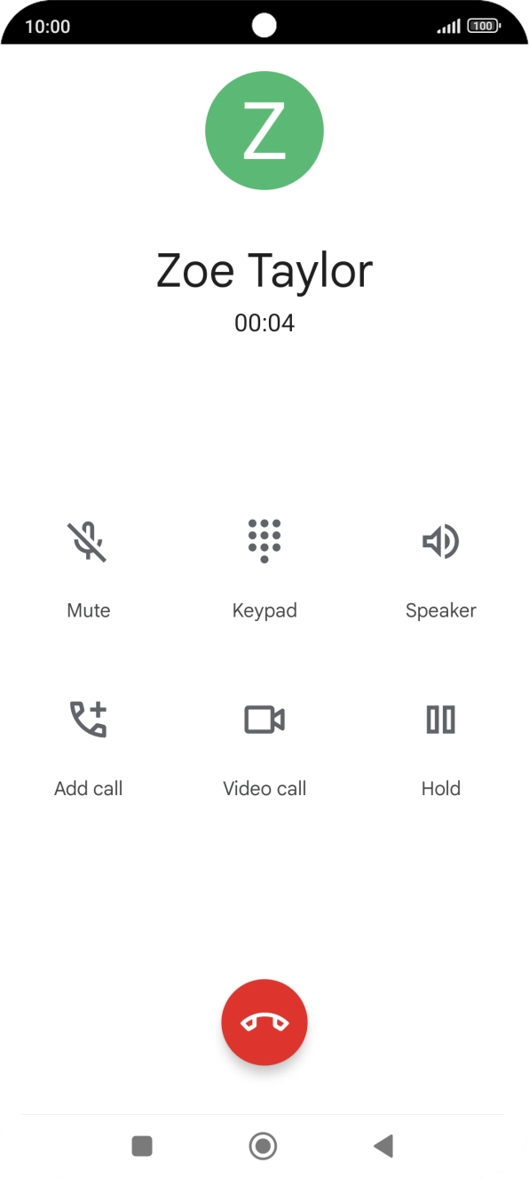 Press the end call icon.