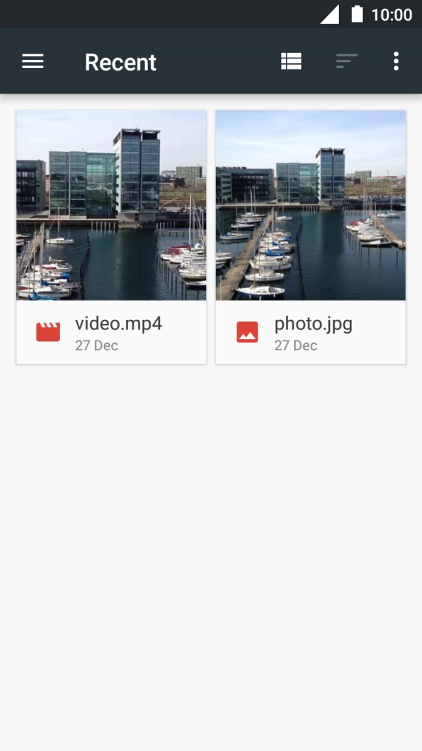 Slide your finger right starting from the left side of the screen.
