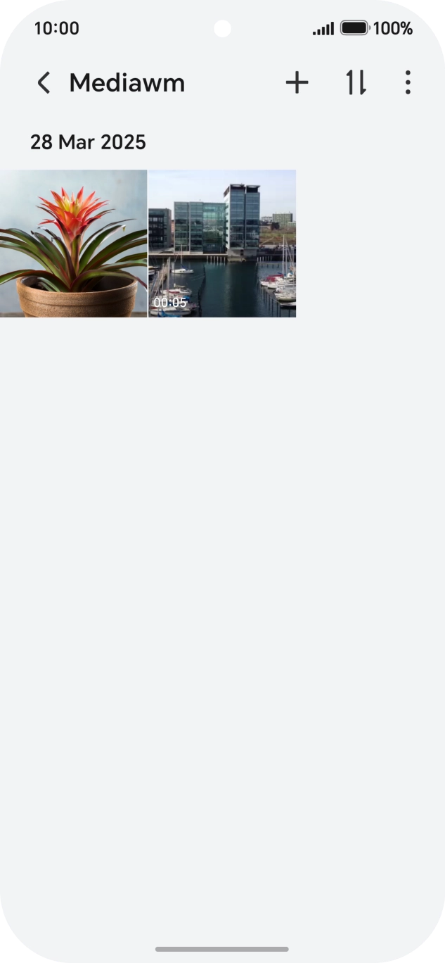 Press and hold any picture or video.