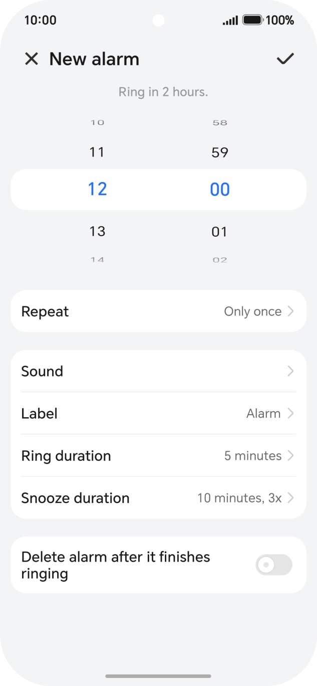 Slide your finger up or down on the hour and minute numbers to set the required alarm time.