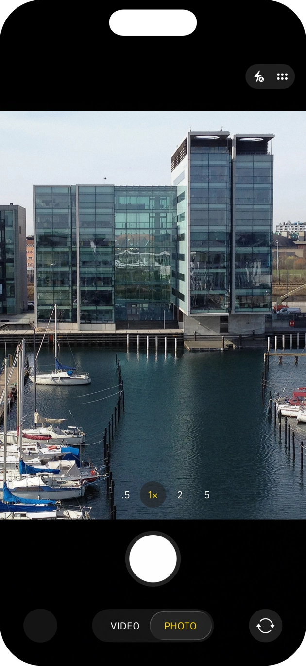 Slide your finger right or left on the screen to select the required camera mode.