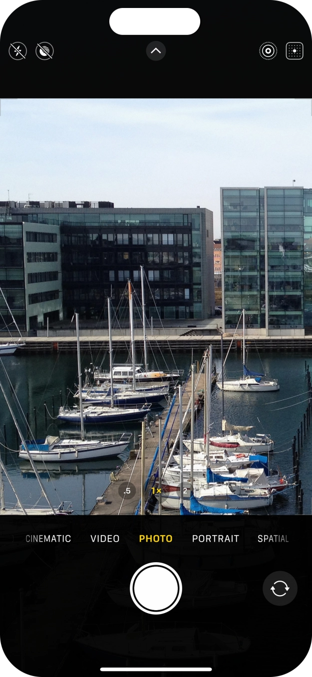 Slide your finger right or left on the screen to select the required camera mode.