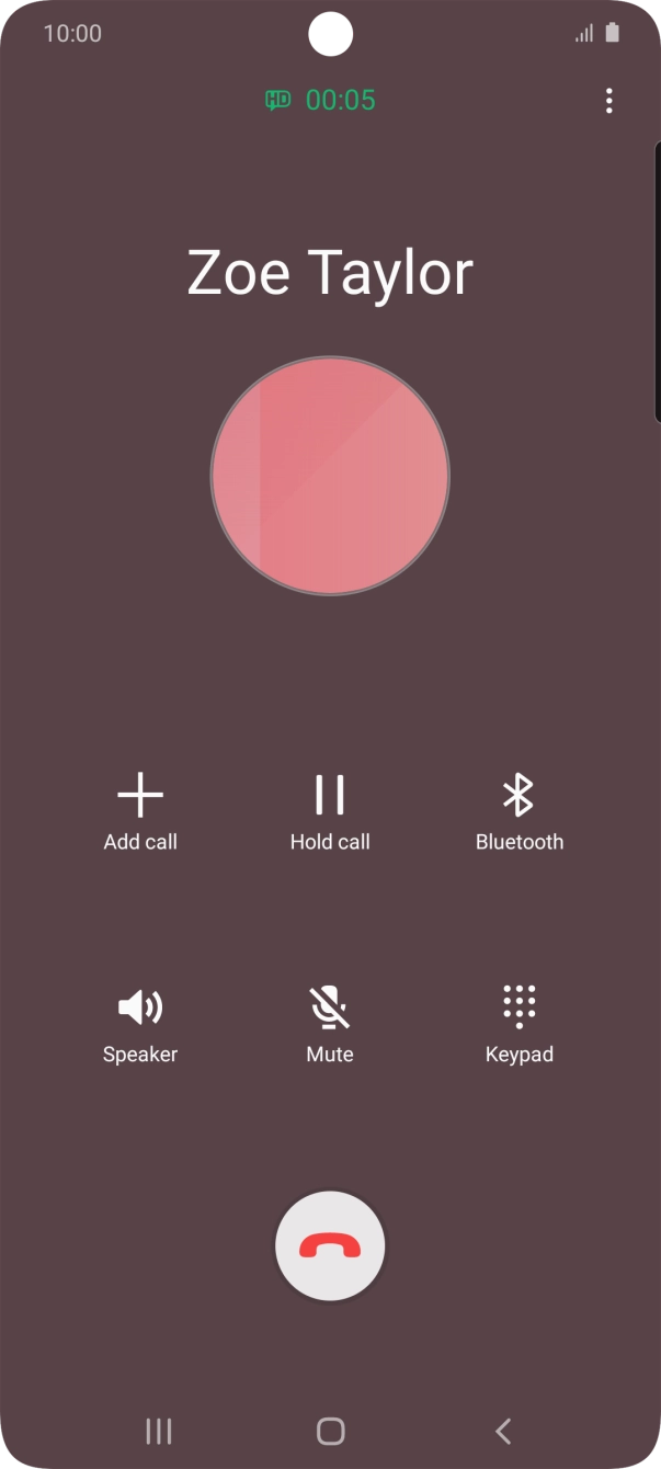 Press the end call icon.