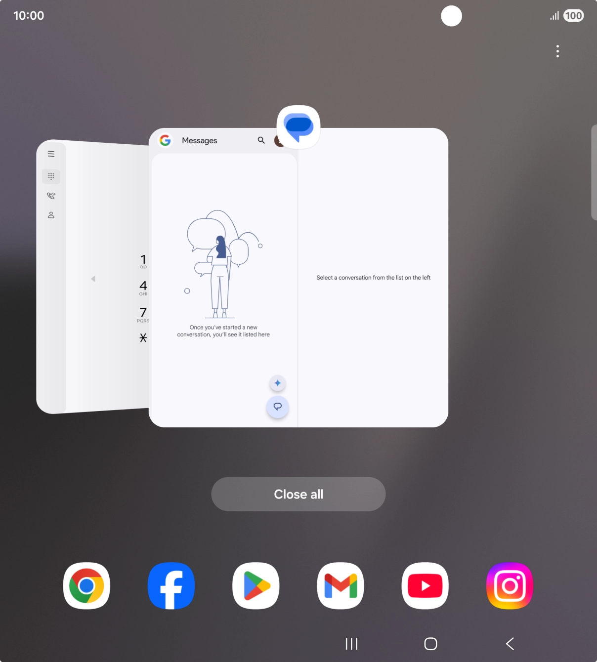 Press the first application and drag it to the top or bottom of the screen.