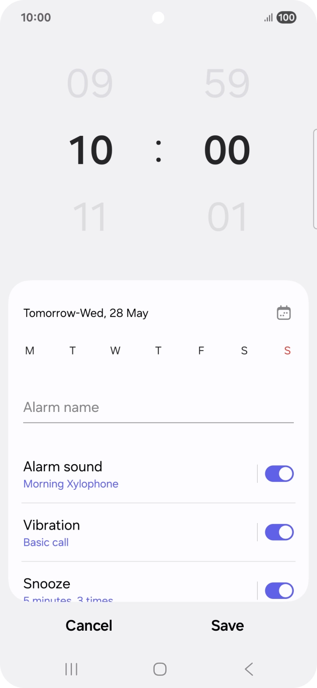 Slide your finger up or down on the hour and minute numbers to set the required alarm time.