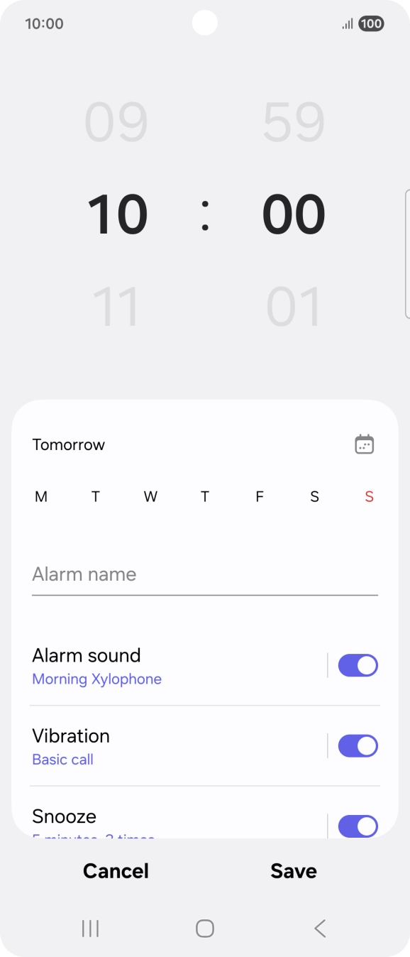 Slide your finger up or down on the hour and minute numbers to set the required alarm time.
