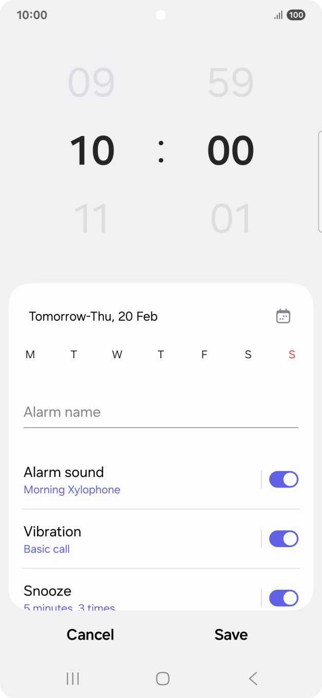 Slide your finger up or down on the hour and minute numbers to set the required alarm time.