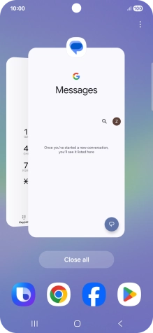 Press the first application and drag it to the top or bottom of the screen.