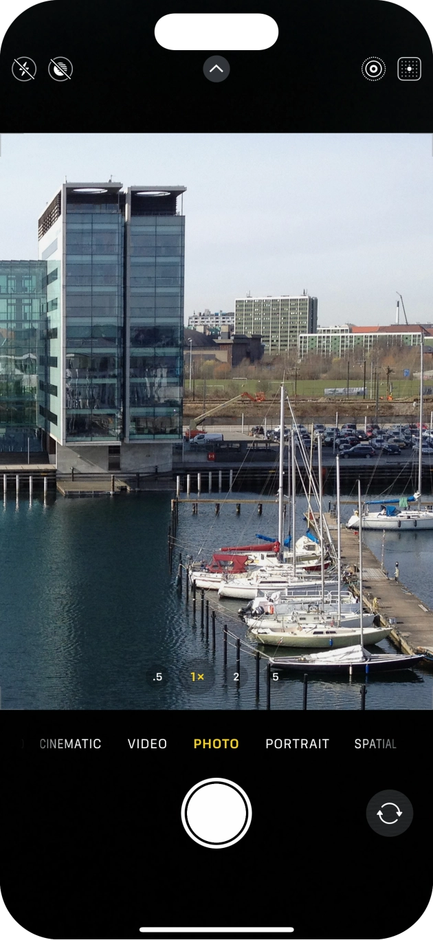 Slide your finger right or left on the screen to select the required camera mode.