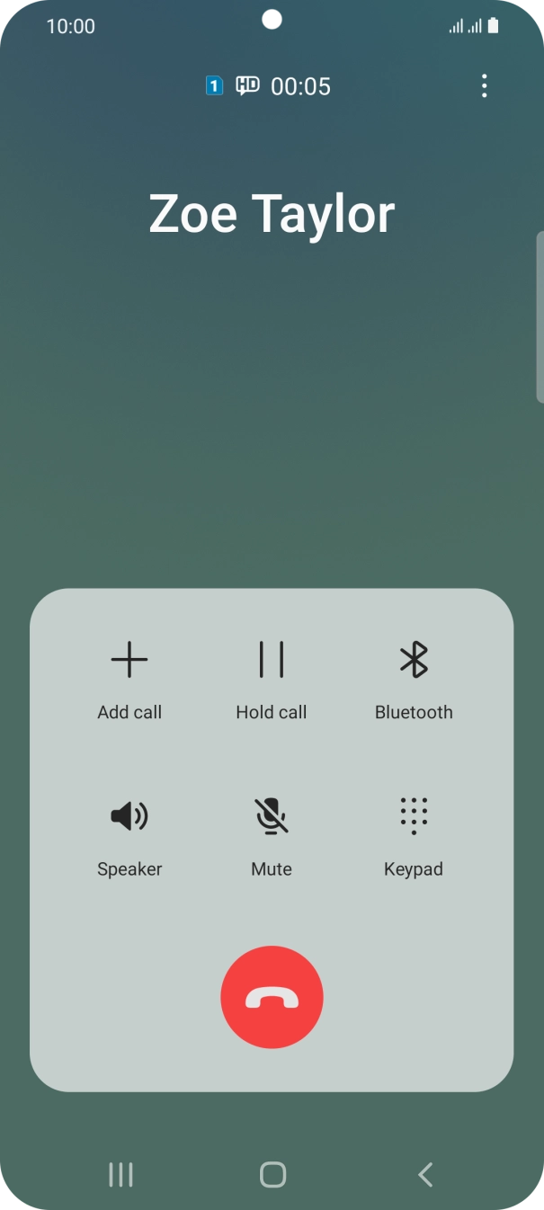 Press the end call icon.
