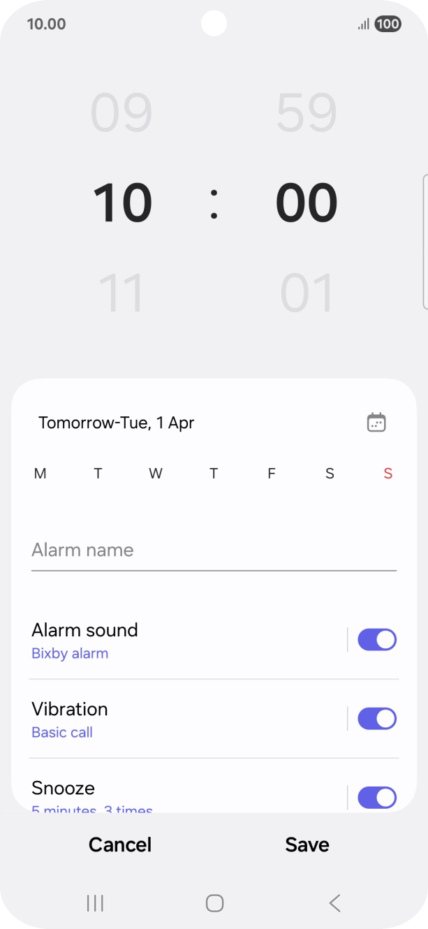 Slide your finger up or down on the hour and minute numbers to set the required alarm time.