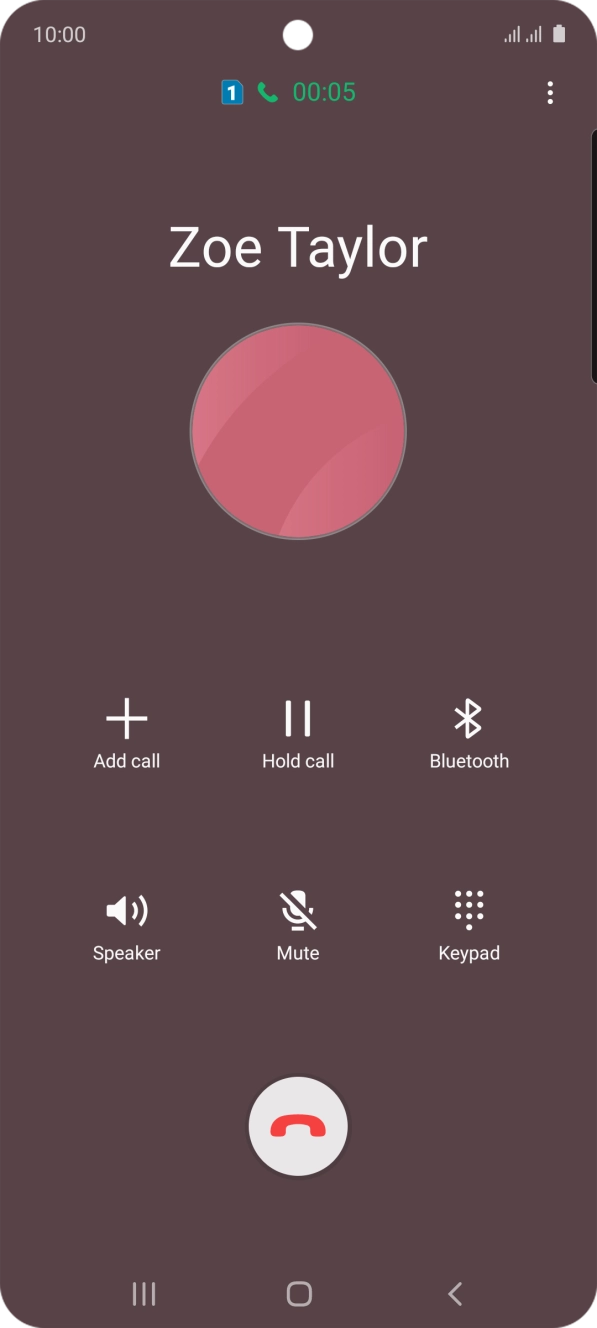 Press the end call icon.