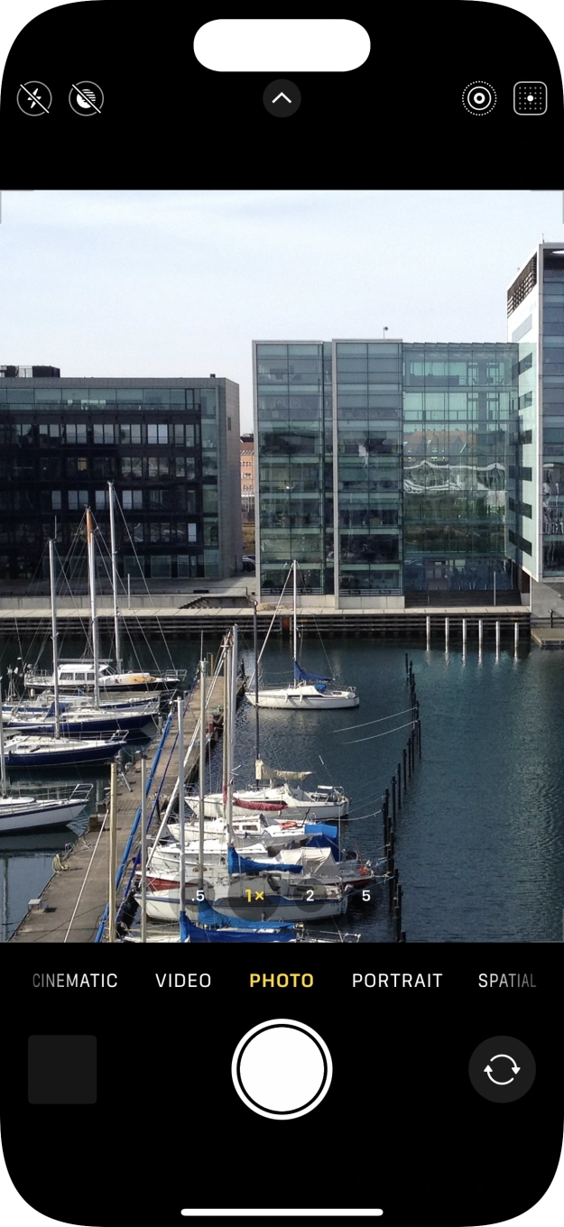 Slide your finger right or left on the screen to select the required camera mode.