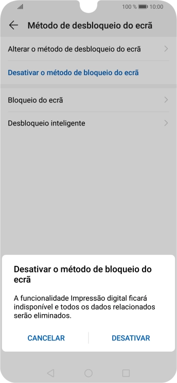 Introduza o código de bloqueio do telefone atual e prima DESATIVAR.