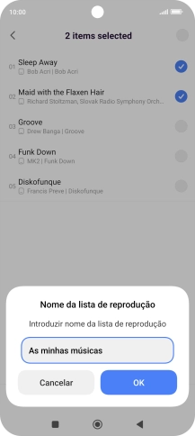 Introduza o nome pretendido para a lista de reprodução e prima OK.