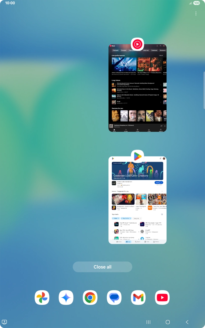 Press the first application and drag it to the top or bottom of the screen.