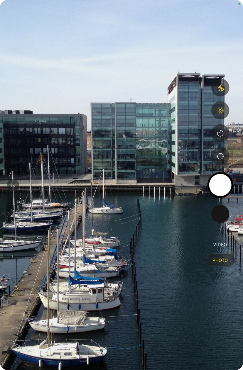 Slide your finger up or down on the screen to select the required camera mode.