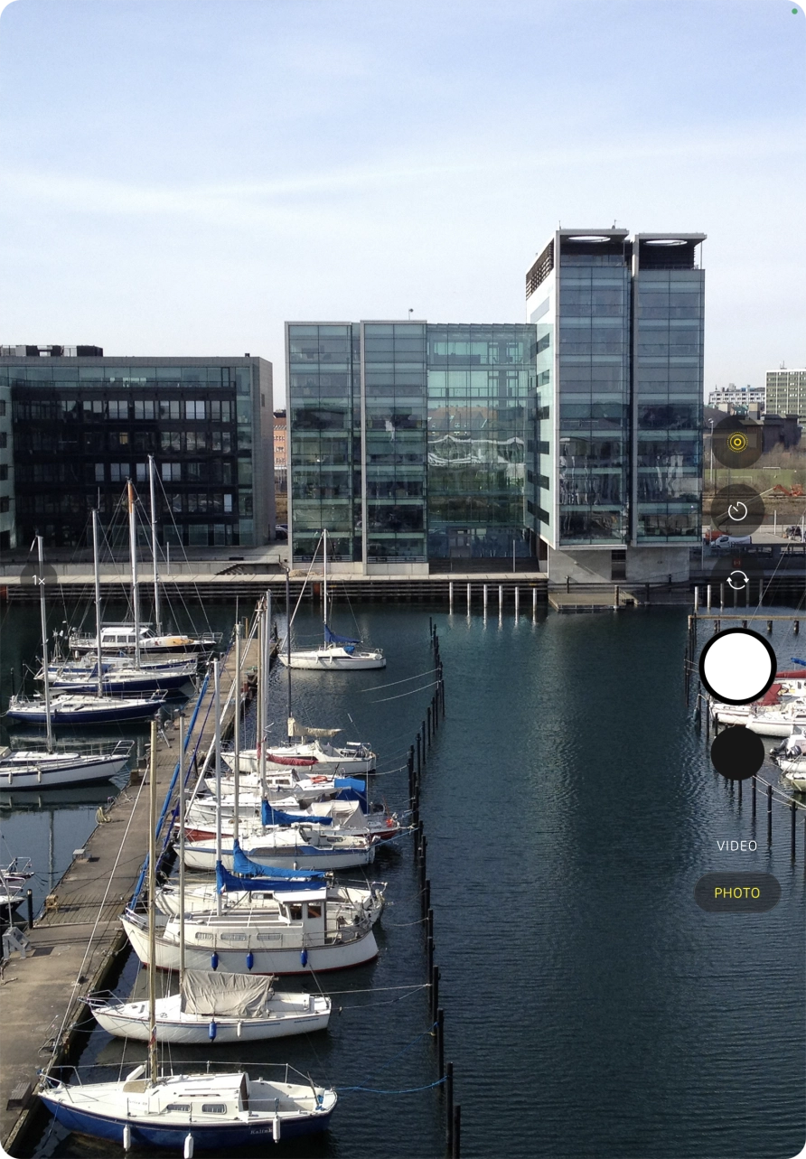 Slide your finger up or down on the screen to select the required camera mode.