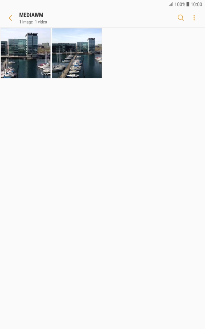 Press and hold the required picture or video clip. Press and hold the required picture or video clip.
