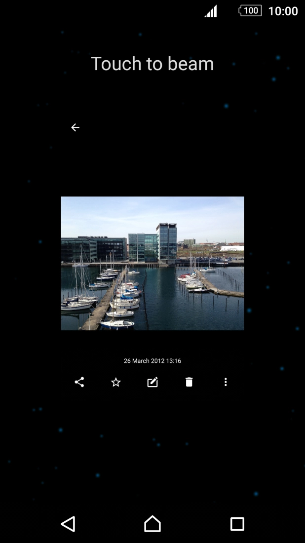 Hold the back of your phone close to back of the receiving device. Press Touch to beam and wait while the file is transferred. Hold the back of your phone close to back of the receiving device. Press Touch to beam and wait while the file is transferred.