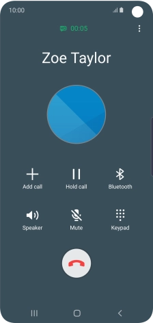 Press the end call icon.