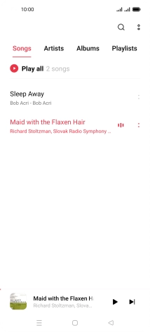 Press the song title at the bottom of the screen.
