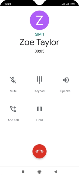Press the end call icon.