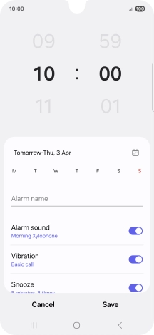 Slide your finger up or down on the hour and minute numbers to set the required alarm time.