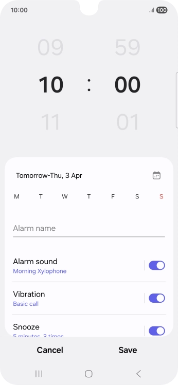 Slide your finger up or down on the hour and minute numbers to set the required alarm time.
