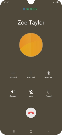 Press the end call icon.
