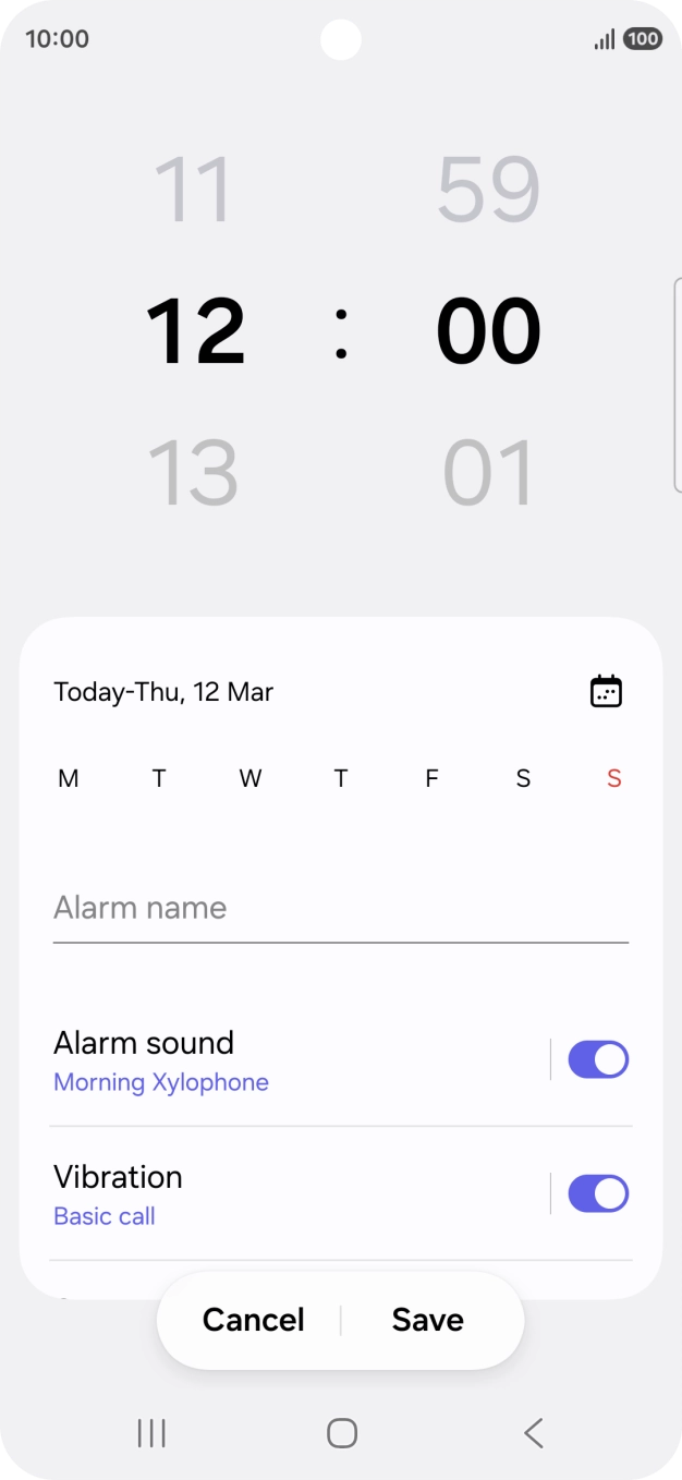 Slide your finger up or down on the hour and minute numbers to set the required alarm time.