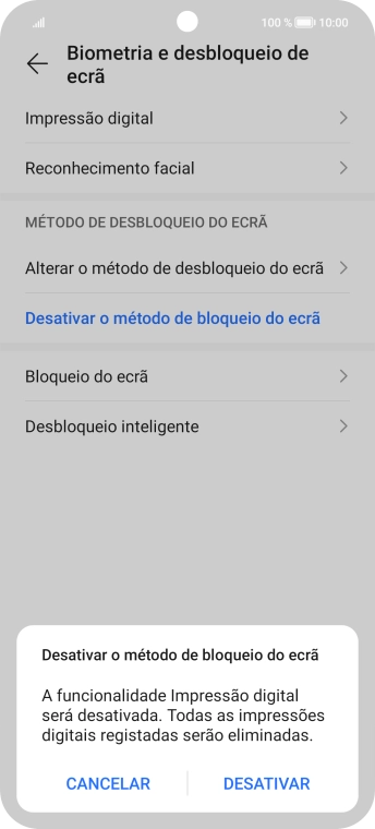 Introduza o código de bloqueio do telefone atual e prima DESATIVAR.