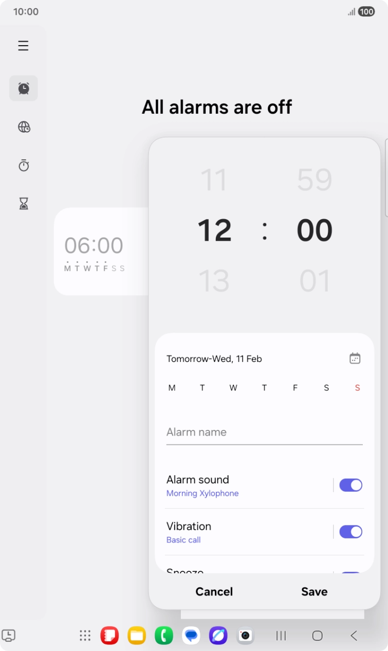 Slide your finger up or down on the hour and minute numbers to set the required alarm time.