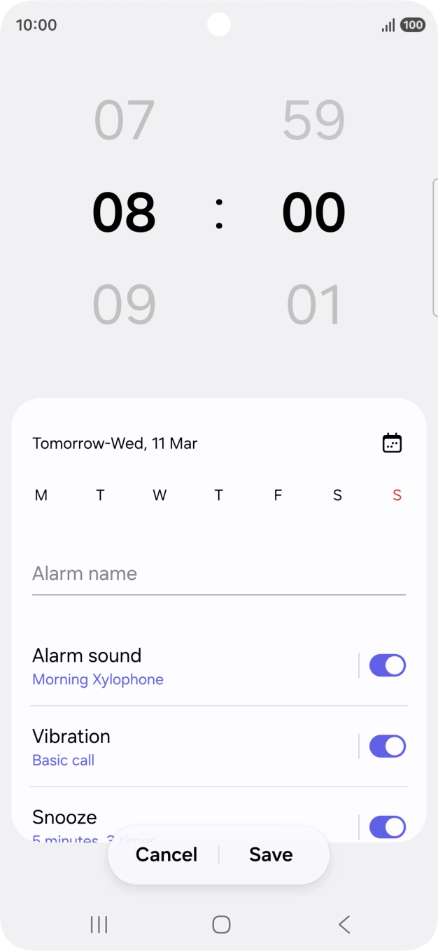 Slide your finger up or down on the hour and minute numbers to set the required alarm time.