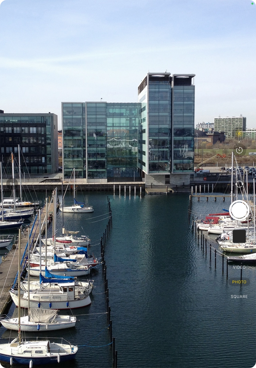 Slide your finger up or down on the screen to select the required camera mode.