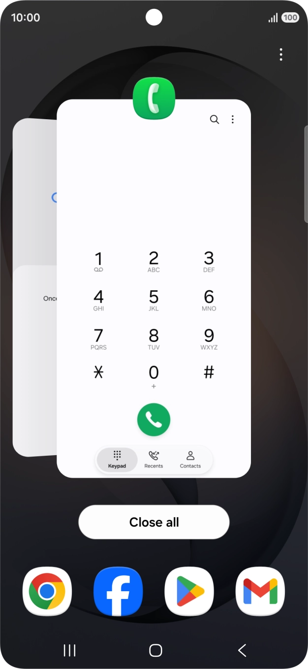 Press the first application and drag it to the top or bottom of the screen.