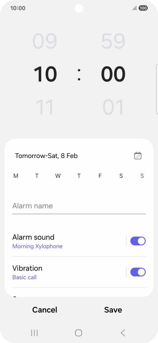 Slide your finger up or down on the hour and minute numbers to set the required alarm time.