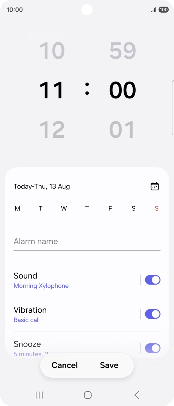Slide your finger up or down on the hour and minute numbers to set the required alarm time.