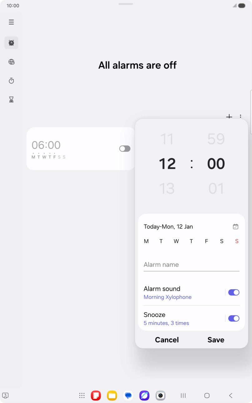 Slide your finger up or down on the hour and minute numbers to set the required alarm time.