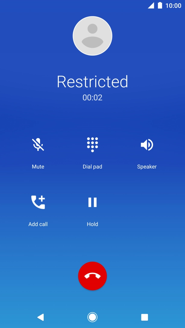 Press the end call icon.