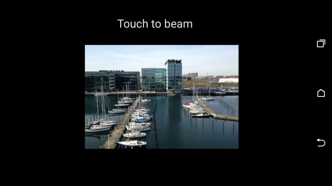 Hold the back of your phone close to back of the receiving device. Press Touch to beam and wait while the file is transferred. Hold the back of your phone close to back of the receiving device. Press Touch to beam and wait while the file is transferred.