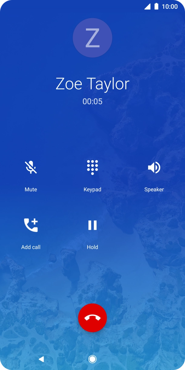 Press the end call icon.