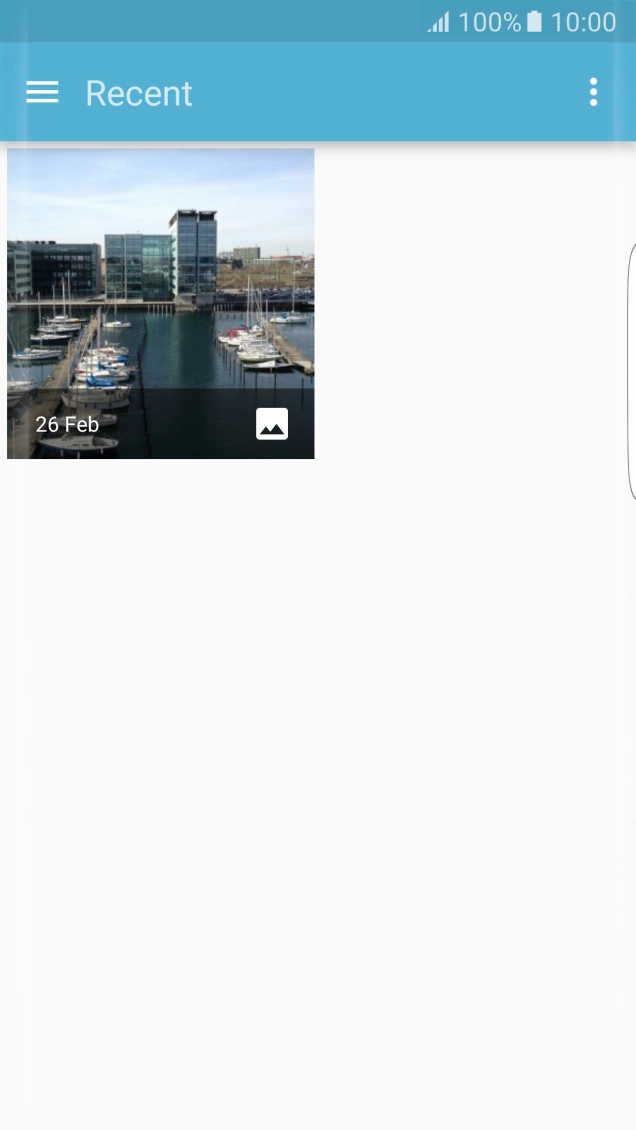Slide your finger right starting from the left side of the screen.