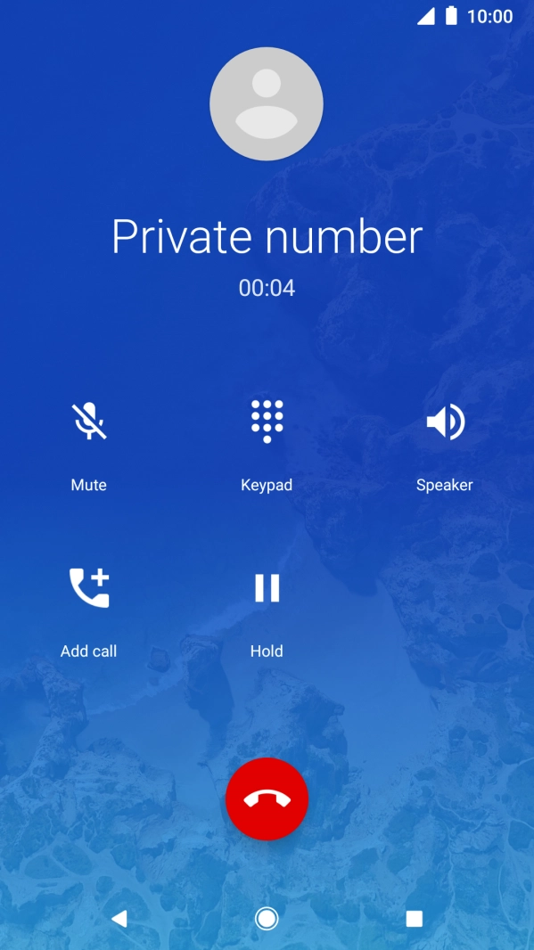 Press the end call icon.