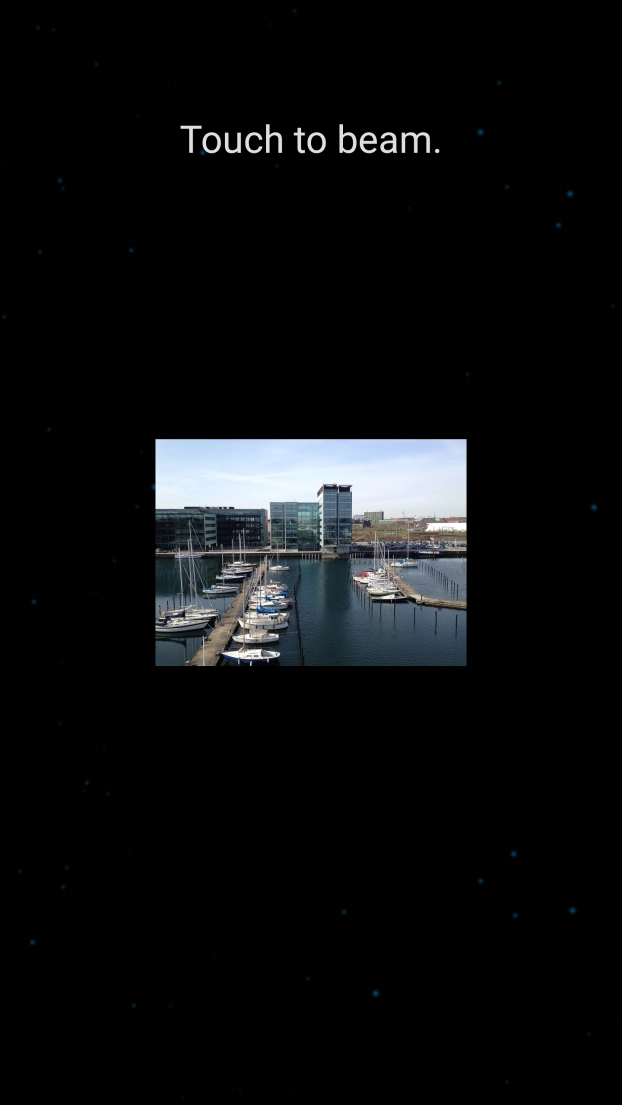 Hold the back of your phone close to back of the receiving device. Press Touch to beam. and wait while the file is transferred.