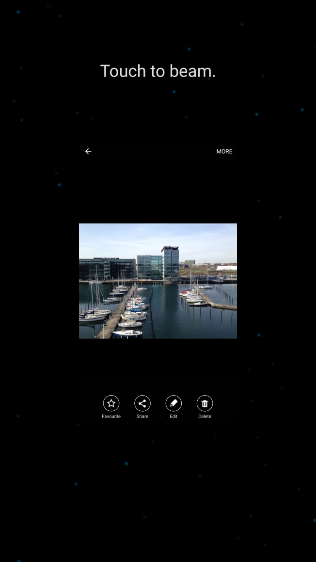 Hold the back of your phone close to back of the receiving device. Press Touch to beam. and wait while the file is transferred.